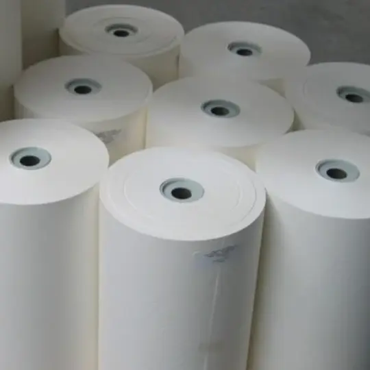 Bleached extensible sack kraft paper